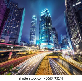 Nighttime Cityscape Of Hong Kong With Skyscrapers And Highways. Scenic Travel Background.
