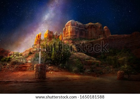 Nighttime scene of spititual vortex site at Cathedral Rock in Sedona, Arizona USA illuminated by the glow of the Milky Way and stars in the sky