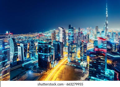 Nighttime Skyline Of Dubai, United Arab Emirates. Rooftop View. 