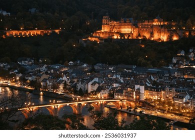 Nighttime view of a historic European city with an illuminated castle on the hillside, a stone bridge, and riverside buildings, creating a romantic, enchanting scene. - Powered by Shutterstock