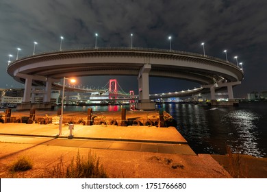 Nightview of Rainbow Bridge, illuminated in red as a sign of 