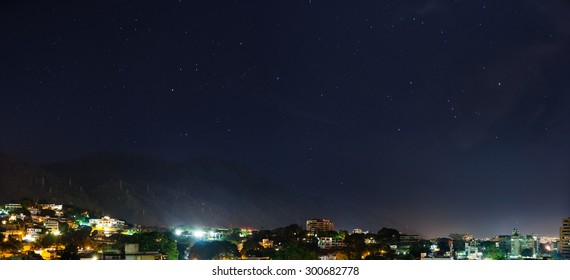 Nightview with stars and Avila Mountain's silhouette, at Caracas city, in Venezuela