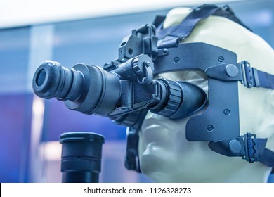 Night-vision device. Helmet with night vision. A standard telescopic sight is completed with a night sight in front. night optical observing device. NVD