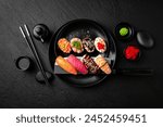 Nigiri composition on black background. The Art of Japanese Cuisine. Food photography for menu and sushi bar decoration