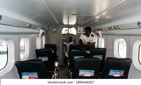Nika resort, Maldives, 03.29.2020 Black seaplane pilot in the cockpit of an aircraft