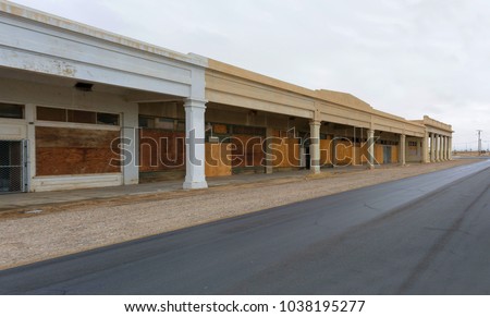 Niland, CA, is not known for its prosperity. Like in most communities around Salton Sea many streets show shuttered businesses and boarded up shops like this.