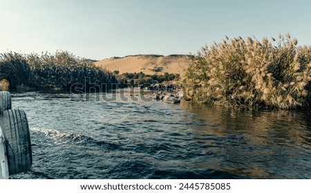 Nile valley natural landscape view from water on river bank,  
Travel Egypt Nile cruise