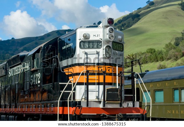 Niles Canyon Train Yard, NILES, CA – APRIL 11, 2011: The\
image shows a Southern Pacific SD9 6-axel road switcher diesel\
locomotive built by General Motors Electromotive division in the\
mid 1950’s. 