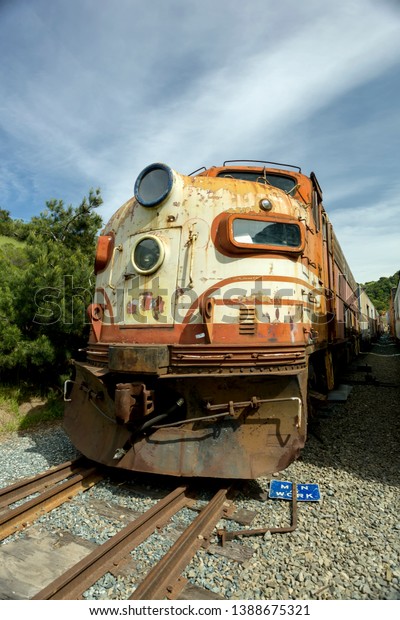Niles Canyon\
Train Yard, NILES, CA – APRIL 11, 2011: The image shows an old\
rusty locomotive waiting to b e restored. It’s an EMD F7 is a 1,500\
horsepower Diesel-electric\
locomotive.