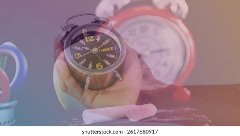 Nimation of clock over hand holding clock. global business and digital interface concept digitally generated image. - Powered by Shutterstock - Get 15% off with code: PIKWIZARD15