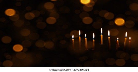 Nine Chanukah Candles With Dark Bokeh Lights Background Web Banner