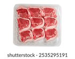 Nine fresh lamb loin chops on a plastic tray. High quality meat product on the bone cut by butcher in perfect size for cooking. Food supply chain and agriculture industry. White background.