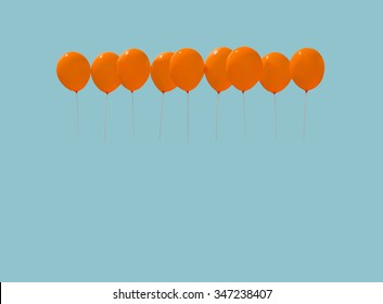 Nine orange balloons soaring against light blue sky with copy space in vintage blue tone.