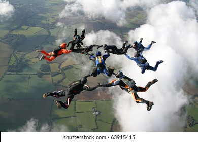 Nine skydivers in freefall