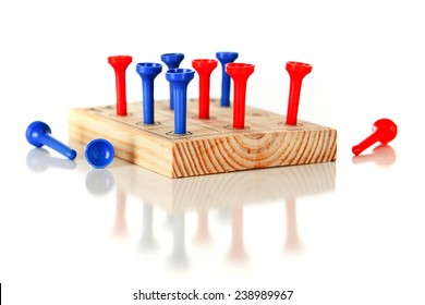 A Nine-hole Pegboard Game With Eight Holes Filled And Three Left Over.  On A White Background.