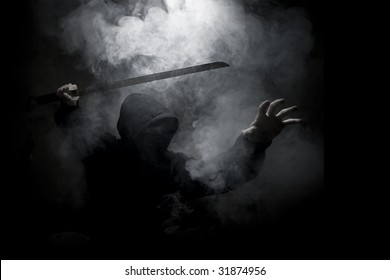 Ninja With Sword At Night In Smoke