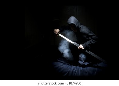 Ninja with sword at night in smoke