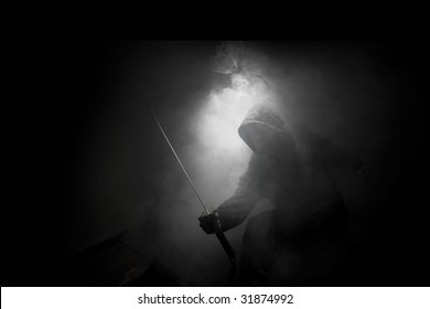 Ninja with sword at night in smoke
