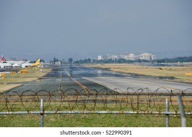 Ninoy Aquino International Airport, Pasay, Philippines - March 2016: Taxi-way Charlie Of Ninoy Aquino International Airport, Philippines Taxi-way In A Scouring Heat With A Mirage Effect - March 2016
