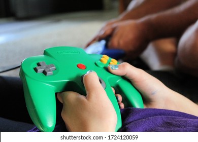 Nintendo 64 Gaming System Controller Being Played