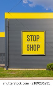 Nis, Serbia - August 04, 2022: Stop Shop Yellow Sign Strip Mall Shopping Centre At Medijana.