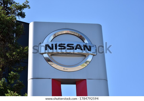 Nissan sign, logo at the Nissan\
Nivette Warszawa car dealer salon. WARSAW, POLAND - JULY 25,\
2020