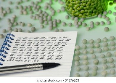 Nitpicker, bean counter. Notepad with tally sheet near beans on a table
