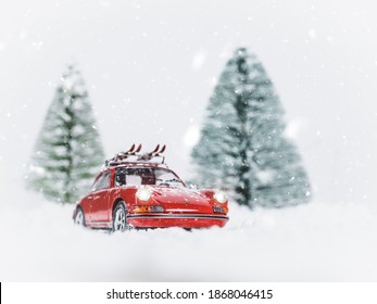 NITRA, SLOVAKIA - DECEMBER 22 2019: Scale Model Porsche 911 With Ski On Snowy Road. Christmas Atmosphere With Porsche.