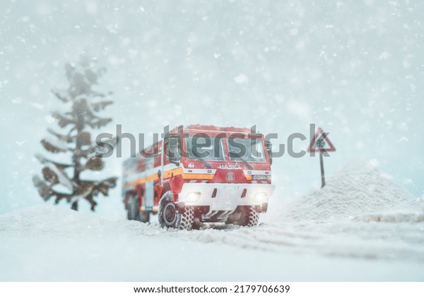 NITRA, SLOVAKIA - JULY 17 2020: Fire truck Tatra\
815-7 on snowy road. Scale model Tatra. Scale model 1:43. Fire\
truck in action.