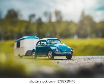 NITRA, SLOVAKIA - JUNY 02 2019: Volkswagen Beetle with caravan in summer camp. Scale model Volkswagen Beetle 1:43. Classic car with caravan.