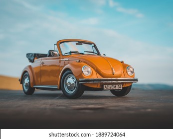 NITRA, SLOVAKIA - JUNY 19 2019: Scale model Volkswagen Beetle Cabrio by summer sunset. Summer sunset atmosphere with VW Beetle. Classic car by sunset. Convertible car.