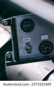 Nitro button on the dashboard of a racing car to increase engine power, nitro switch, nitro power, extra engine power