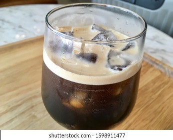 Nitro Coffee In The Glass For Drink On Wood Table Texture