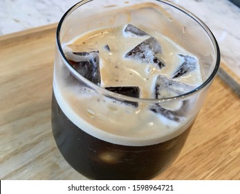 Nitro Coffee In The Glass For Drink On Wood Table Texture