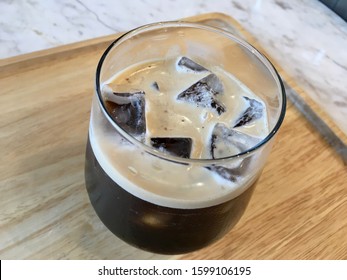 Nitro Coffee In The Glass For Drink On Wood Table Texture