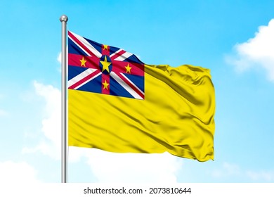 Niue Flying Flag On Clear Sky.