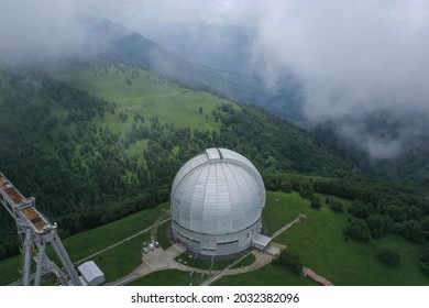 Nizhny Arkhyz, Russia - June 26, 2021: Aerial view of Astrophysical observatory of the Russian Academy of Sciences in Caucasus. BTA tower. Cloudy. Scenic landscape, cosmos, astronomy concept. Summer