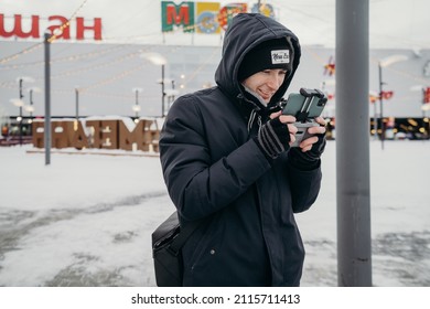 Nizhny Novgorod, December 4, 2021. The Drone Pilot Works Outside In Winter In Cold Weather