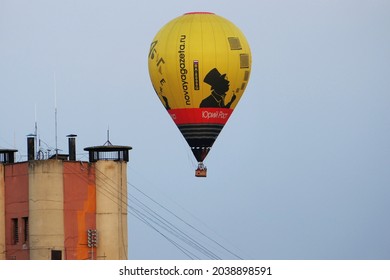 Nizhny Novgorod, Russia, 08.19.2021.Yellow balloon Novaya Gazeta in the sky over the city. Close-up, isolated. High quality photo