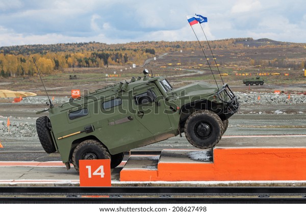 NIZHNY TAGIL,\
RUSSIA - SEP 26, 2013: The international exhibition RUSSIA ARMS\
EXPO (RAE-2013). GAZ Tigr is a Russian 4x4, multipurpose,\
all-terrain infantry mobility\
vehicle