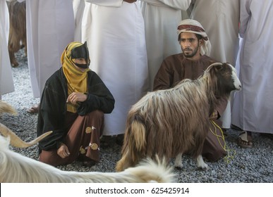 Nizwa, Oma, 24th March, 2017: Omani Couple With A Goat At A Market