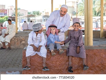 Nizwa, Oman, 10th Nobember 2017: Omani Kid And European Kid Shaking Hands