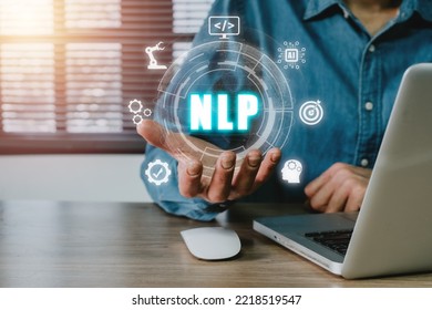 NLP natural language processing cognitive computing technology concept, Business person hand holding VR screen NLP icon on office desk, AI Artificial intelligence.