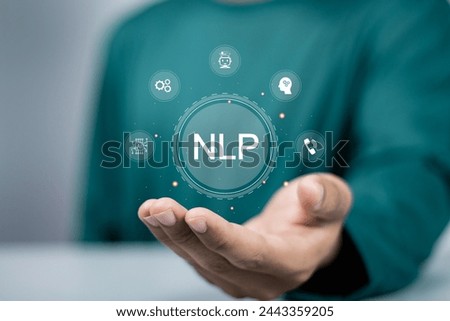 NLP natural language processing cognitive computing technology concept. Person holding NLP icon on virtual screen.