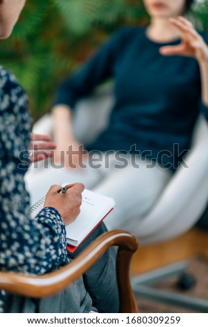 NLP or Neuro-linguistic Programming Practitioner having a Conversation with a client