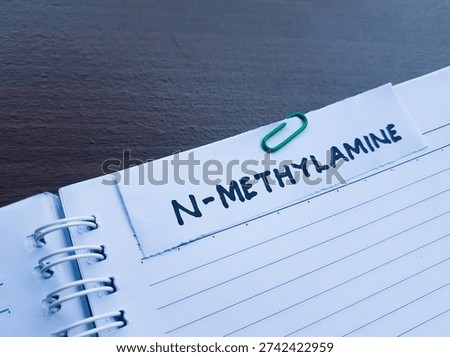 N-methylamine writting on table background. 