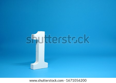 No. 1 ( One ) Isolated Blue  Background with Copy Space - Number 1 Percentage or Promotion success and the best winner Concept - First onject