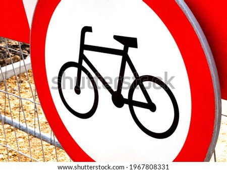No bikes allowed, round red warning biking prohibition sign, simple symbol object detail, closeup, nobody. No bicycles, bikers, cyclists allowed in the area, no cycles, cycling disallowed concept