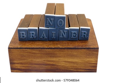NO BRAINER concept spelled out with rubber stamp blocks. Isolated.