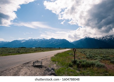 No Camping Sign Near A Road Leading To The Grand Teton Mountain Range Near Jackson Hole, Wyoming. Grand Teton National Park Includes Extraordinary Wildlife, Pristine Lakes, And Alpine Terrain